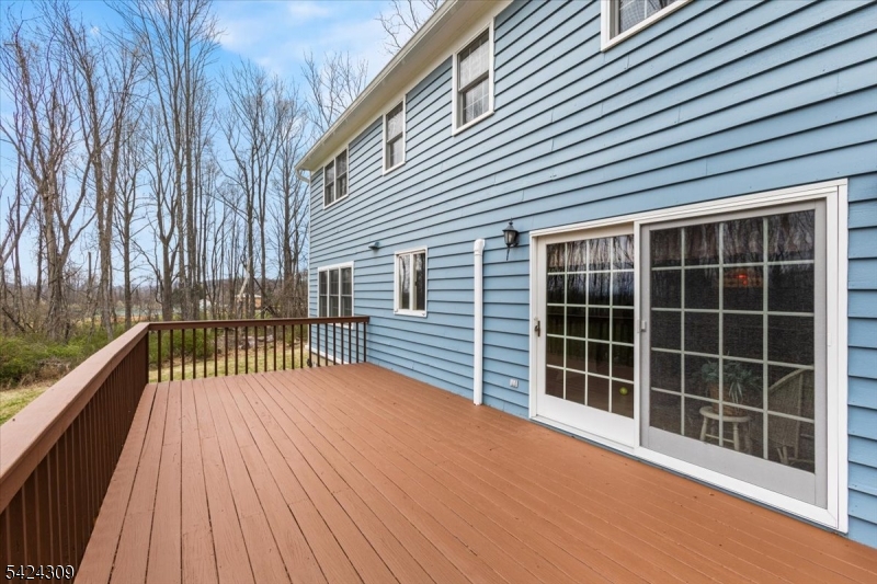 58 Andover Road Sparta, NJ 07871 - Photo 31 of 38 a view of balcony with a large window and wooden floor