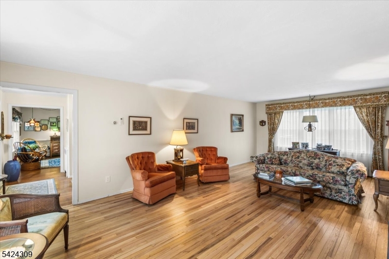 58 Andover Road Sparta, NJ 07871 - Photo 6 of 38 a living room with furniture and a wooden floor