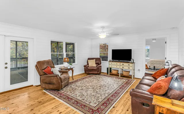 a living room with furniture and a table