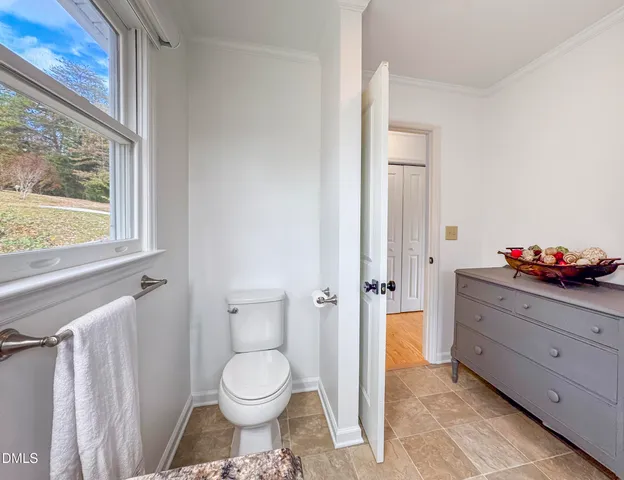a bedroom with a bed and ceiling fan