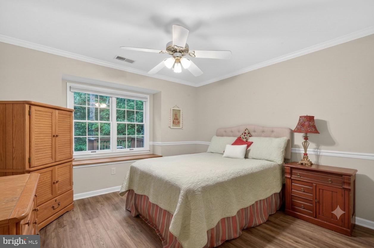 6601 Colchester Road Fairfax Station, VA 22039 - Photo 49 of 78 a bedroom with a large bed and a window