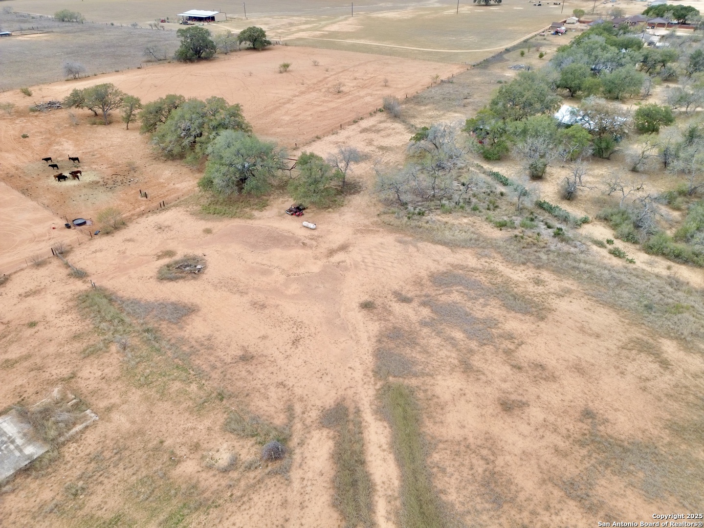 120 South Ridge Drive Lytle, TX 78052 - Photo 2 of 8 a view of a dry yard with snow on the road