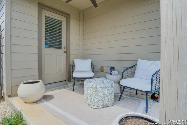 a view of livingroom with furniture and a potted plant
