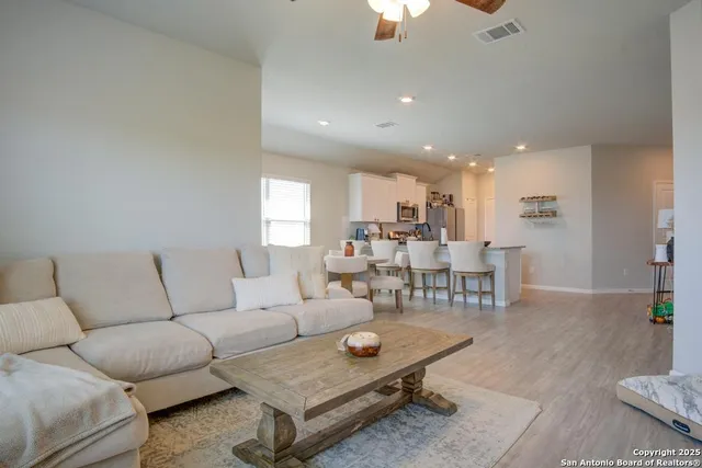 a living room with furniture and a table