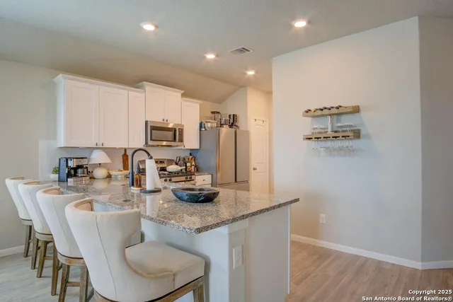 a kitchen with sink cabinets and microwave
