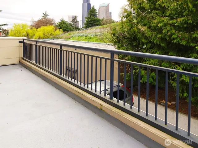 a view of balcony with furniture