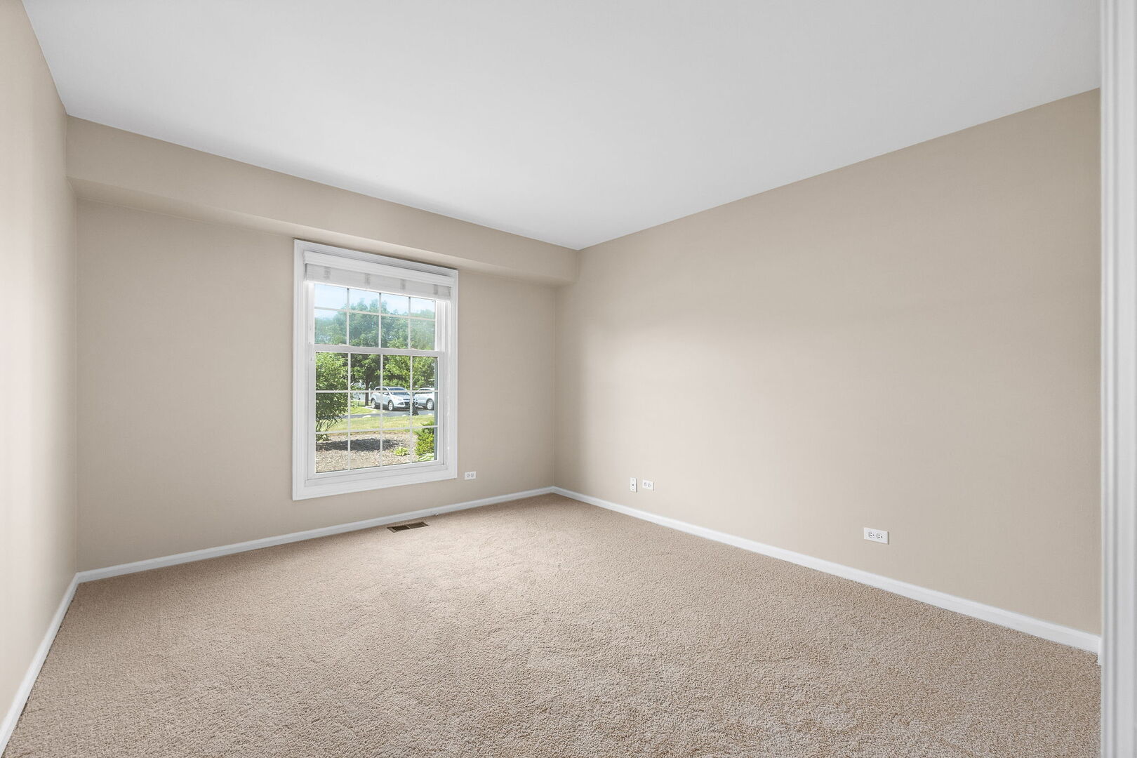 124 Carriage Way Drive, Unit B109 Burr Ridge, IL 60527 - Photo 21 of 31 an empty room with a window