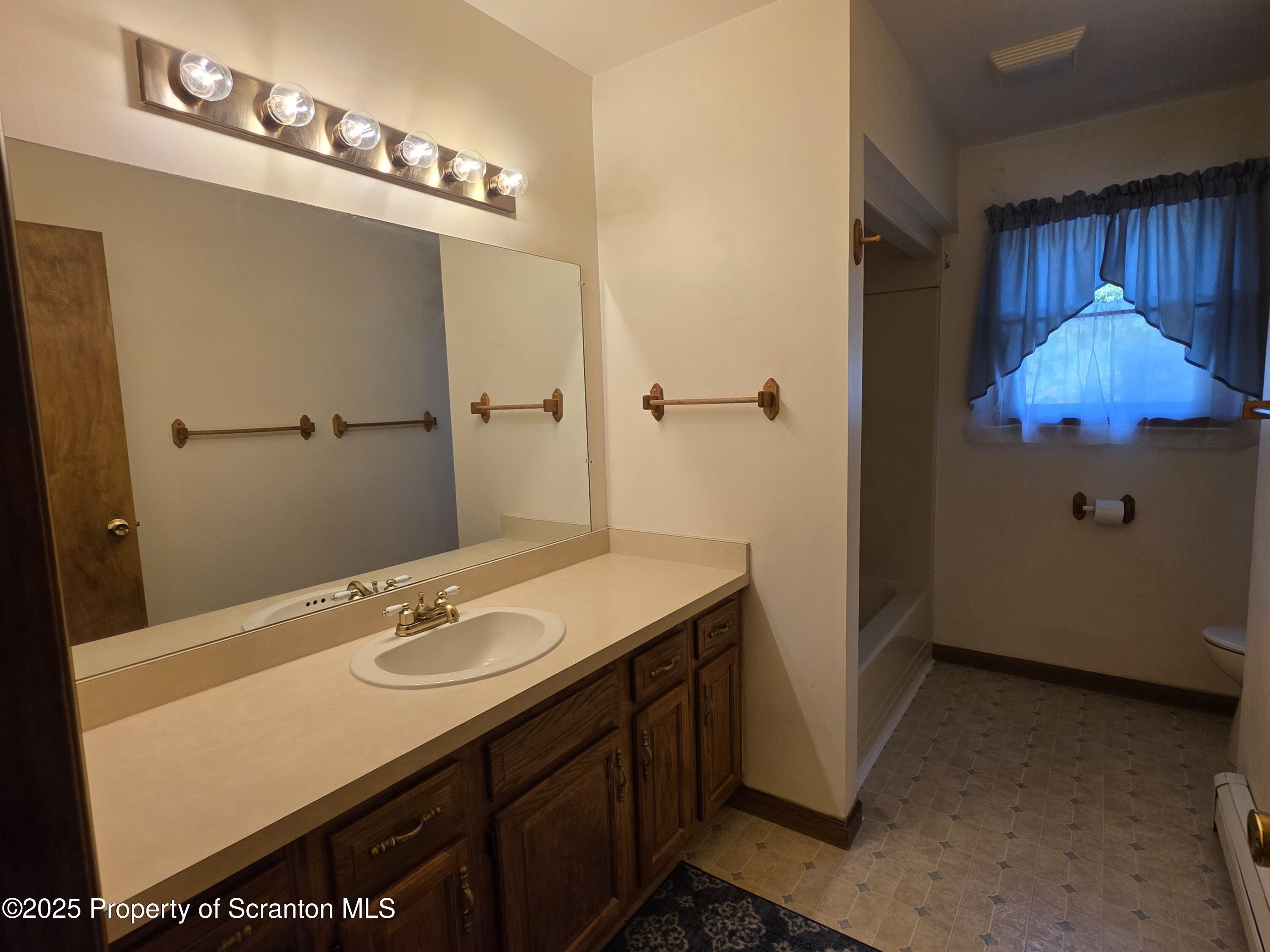 129 Northpoint Drive Olyphant, PA 18447 - Photo 33 of 56 a bathroom with a sink and a mirror