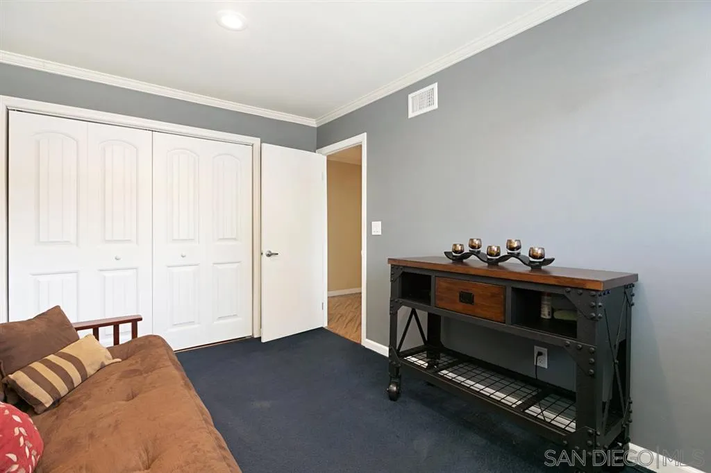 12726 McFeron Road Poway, CA 92064 - Photo 15 of 24 a bed room with furniture and a window