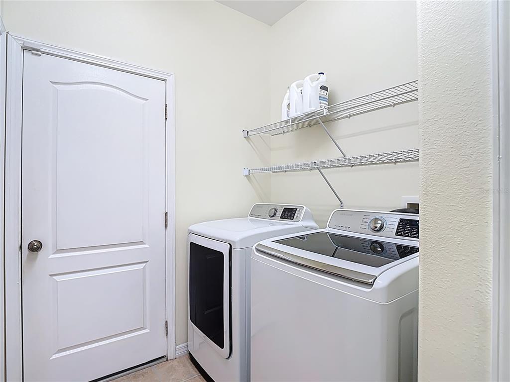 454 Winthrop Drive Spring Hill, FL 34609 - Photo 17 of 20 a utility room with dryer and washer