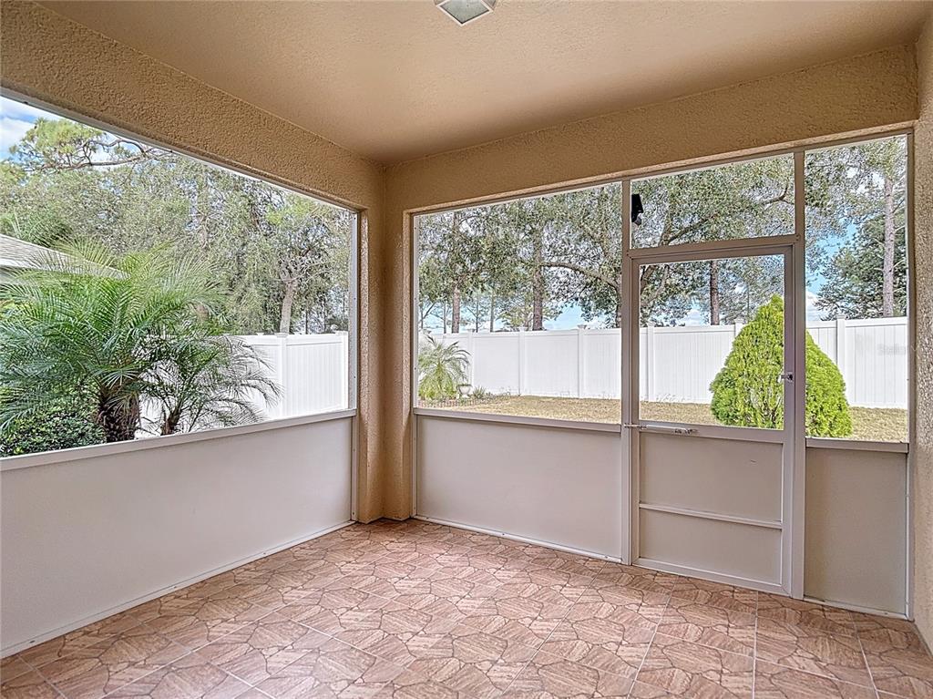 454 Winthrop Drive Spring Hill, FL 34609 - Photo 18 of 20 wooden floor in an empty room with a window