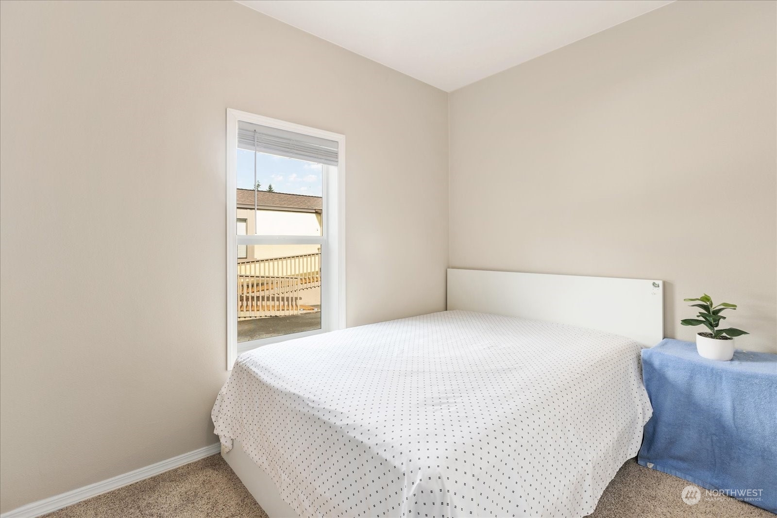 2101 South 324th Street, Unit 176 Federal Way, WA 98003 - Photo 13 of 33 a large bed sitting in a bedroom next to a window