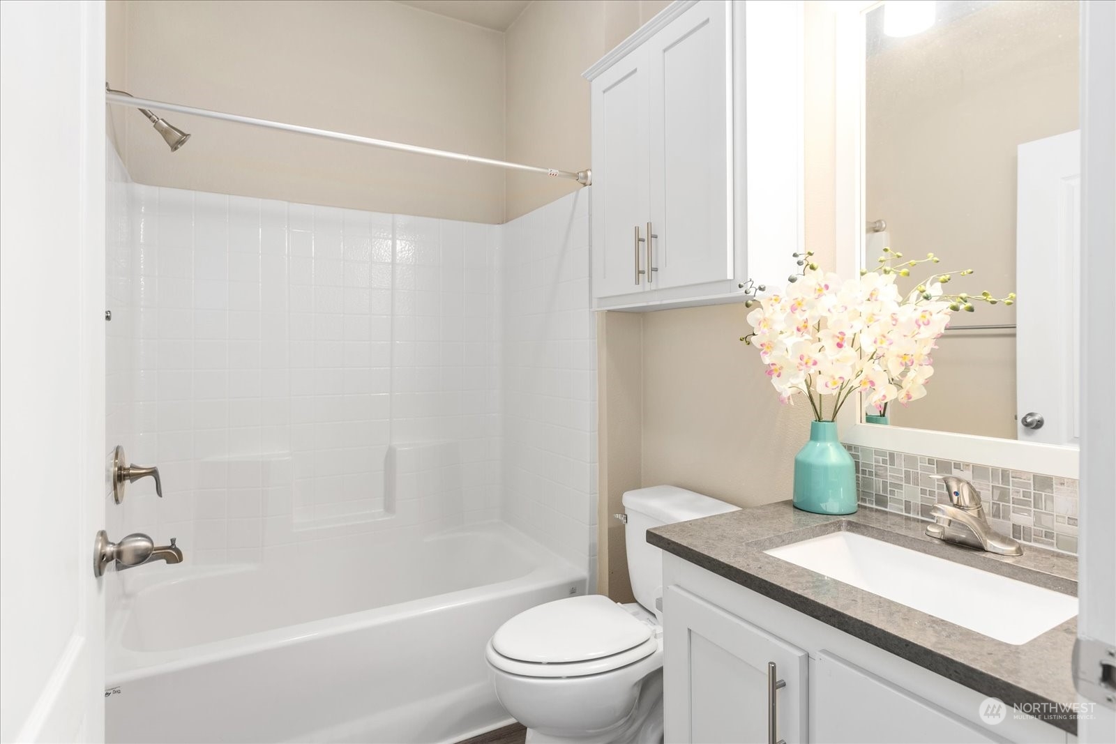 2101 South 324th Street, Unit 176 Federal Way, WA 98003 - Photo 15 of 33 a bathroom with a granite countertop sink a toilet and a bathtub