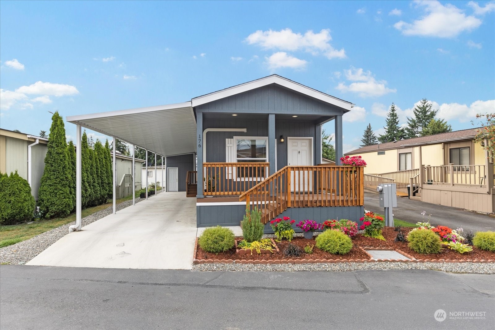 2101 South 324th Street, Unit 176 Federal Way, WA 98003 - Photo 2 of 33 front view of a house with a yard