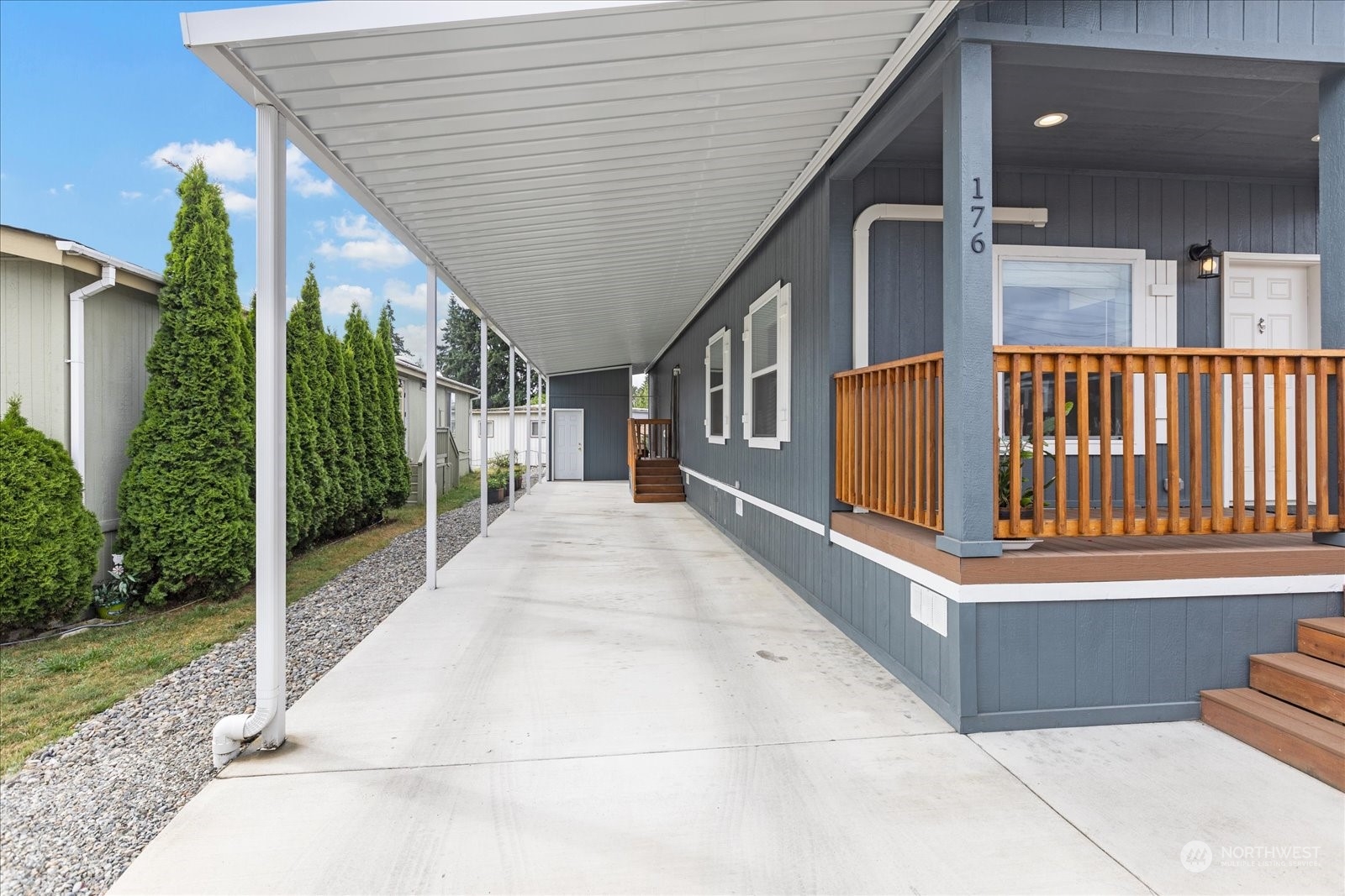 2101 South 324th Street, Unit 176 Federal Way, WA 98003 - Photo 21 of 33 a view of a porch with wooden floor and fence