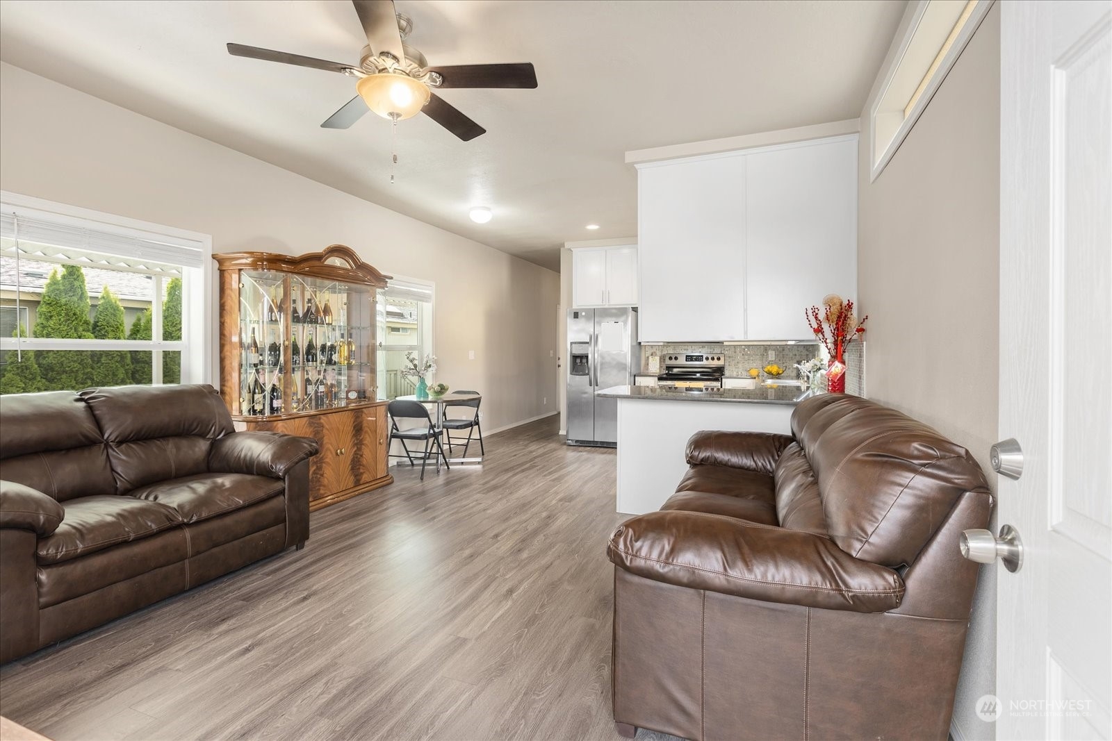 2101 South 324th Street, Unit 176 Federal Way, WA 98003 - Photo 5 of 33 a living room with furniture and kitchen view