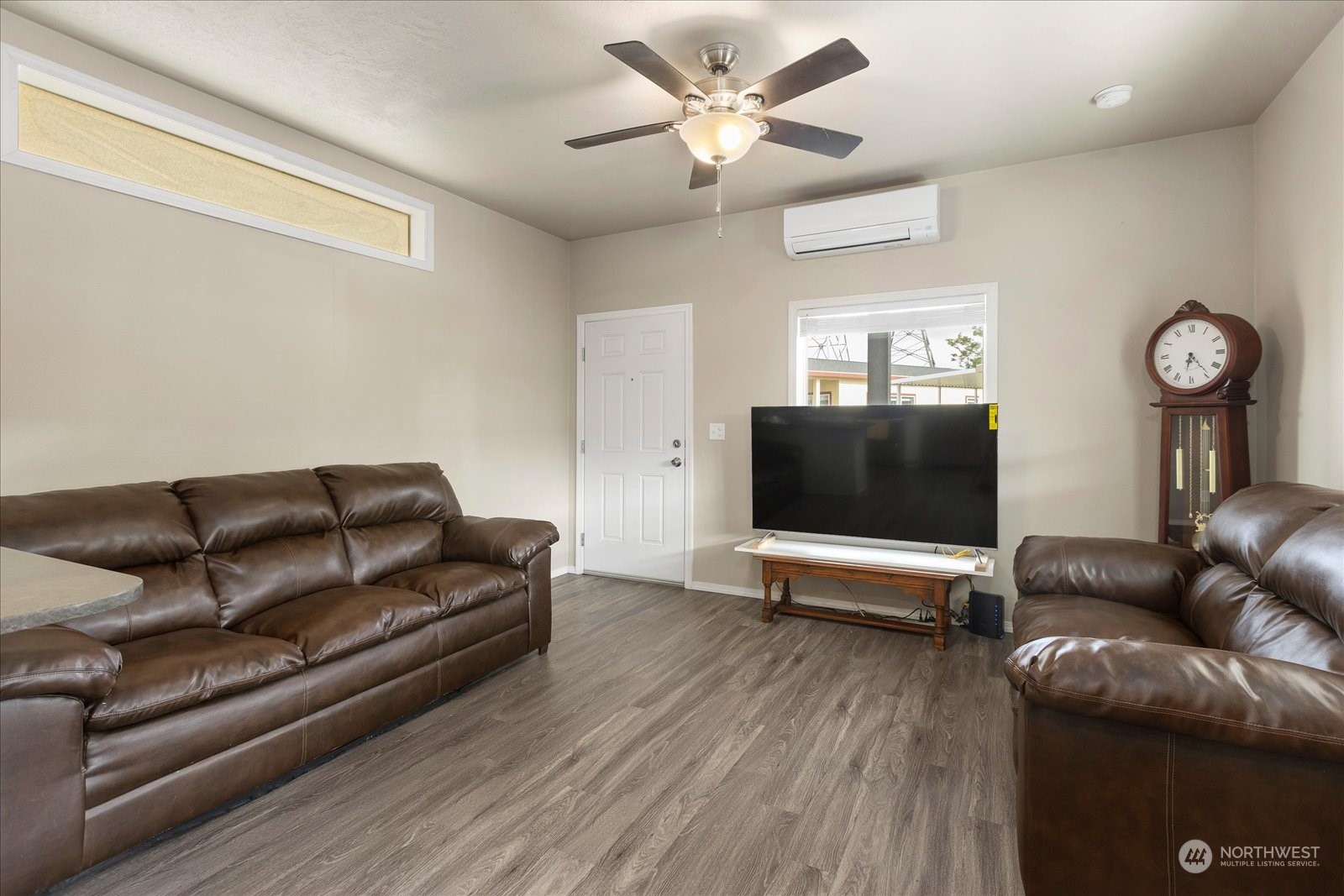2101 South 324th Street, Unit 176 Federal Way, WA 98003 - Photo 8 of 33 a living room with furniture and a flat screen tv