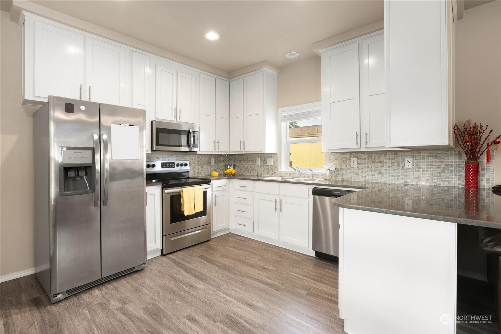 2101 South 324th Street, Unit 176 Federal Way, WA 98003 - Photo 10 of 33 a kitchen with stainless steel appliances a refrigerator sink and microwave