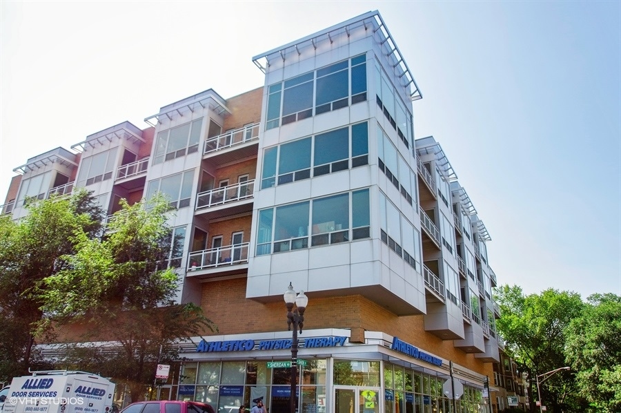 3920 North Sheridan Road, Unit 311 Chicago, IL 60613 - Photo 1 of 10 a front view of a multi story building