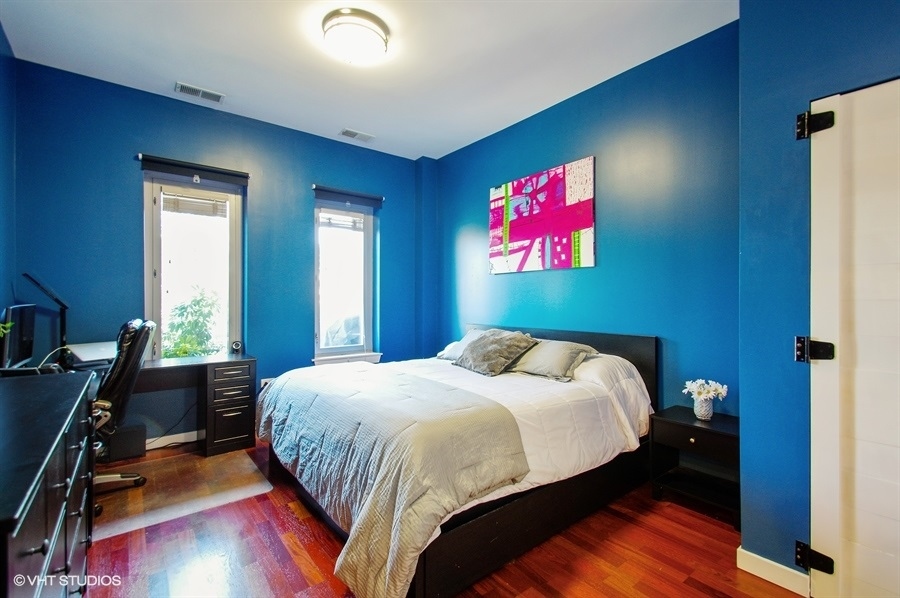 3920 North Sheridan Road, Unit 311 Chicago, IL 60613 - Photo 6 of 10 a bedroom with a bed and a bookshelf