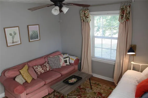 a living room with furniture and a window