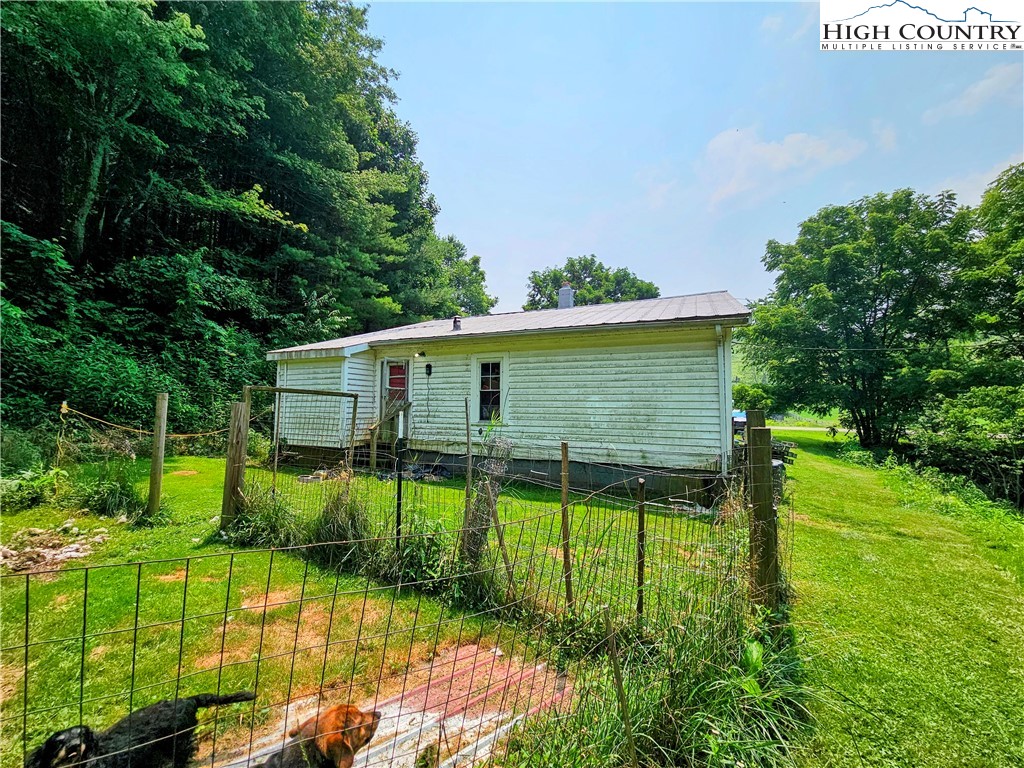 785 West Deep Ford Road Lansing, NC 28643 - Photo 21 of 21 a view of backyard with table and chairs and potted plants