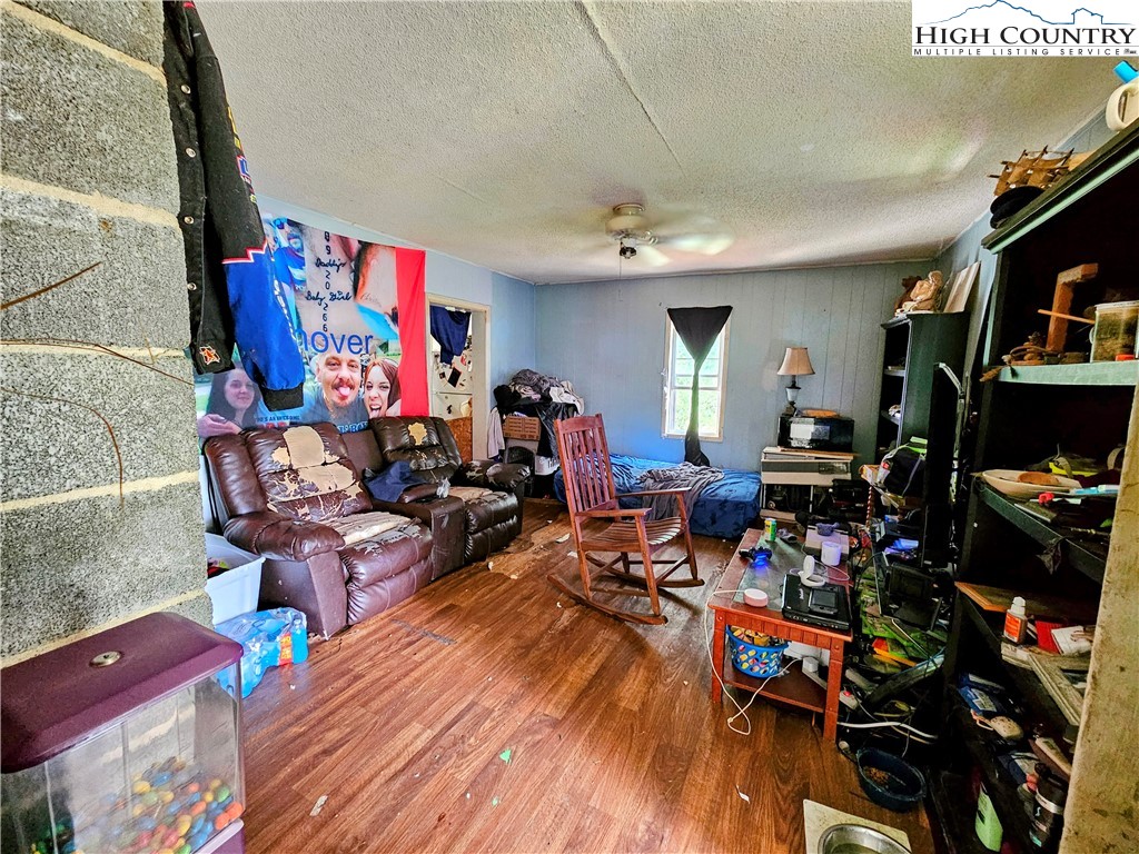 785 West Deep Ford Road Lansing, NC 28643 - Photo 6 of 21 a living room with lots of furniture and a flat screen tv