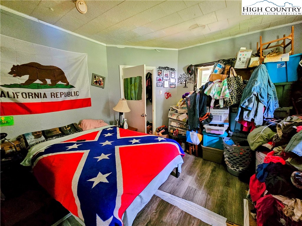 785 West Deep Ford Road Lansing, NC 28643 - Photo 8 of 21 a view of walk in closet with clothes and shoes