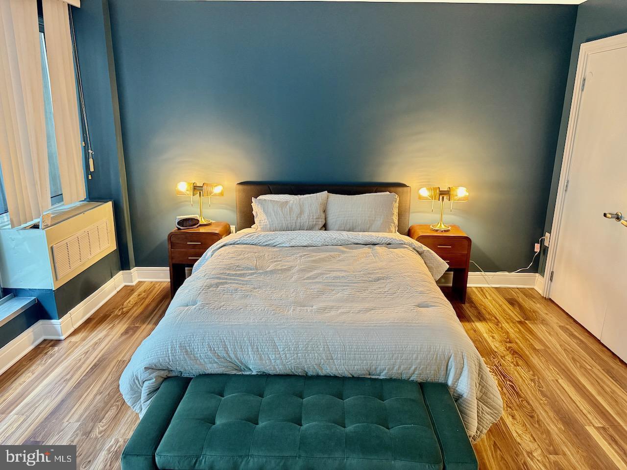 800 4th Street Southwest, Unit N123 Washington, DC 20024 - Photo 3 of 11 Serene bedroom with calming blue hues.