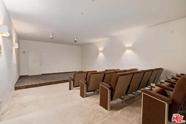 a view of a bedroom with a bed and a cabinets