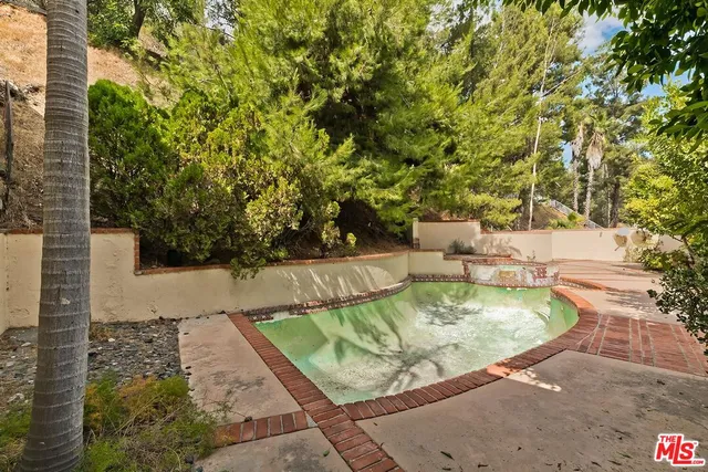 a view of a house with swimming pool