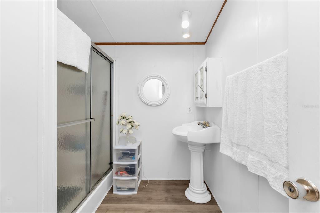 6128 Padula Street Punta Gorda, FL 33950 - Photo 15 of 24 a bathroom with a sink and a mirror