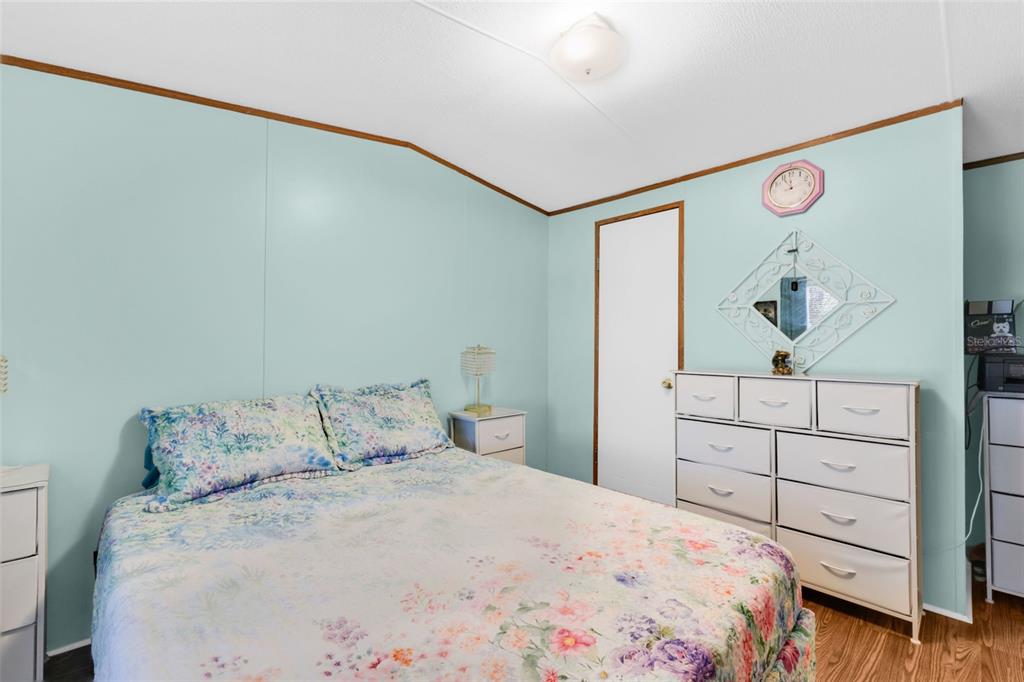 6128 Padula Street Punta Gorda, FL 33950 - Photo 17 of 24 a bedroom with a bed and a cabinets