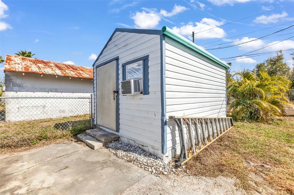 6128 Padula Street Punta Gorda, FL 33950 - Photo 18 of 24 a front view of a house with a yard