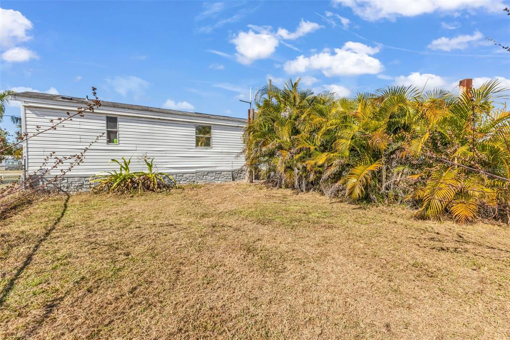 6128 Padula Street Punta Gorda, FL 33950 - Photo 22 of 24 a backyard of a house