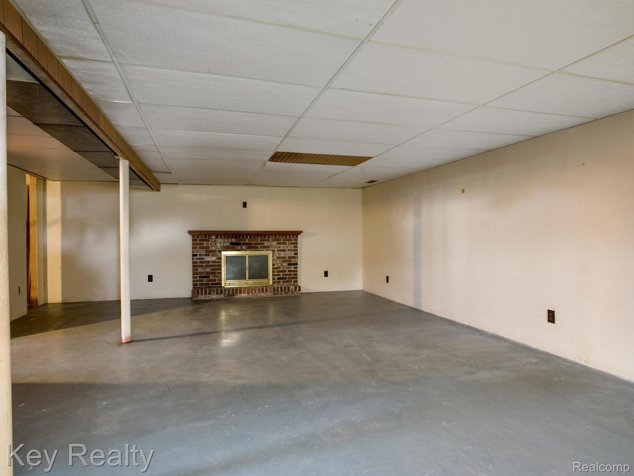 8040 Duffield Road Gaines, MI 48436 - Photo 19 of 25 Partially Finished basement with a fireplace!