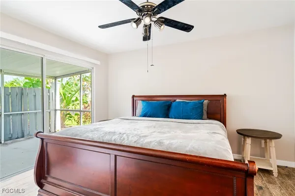 a bedroom with bed and window