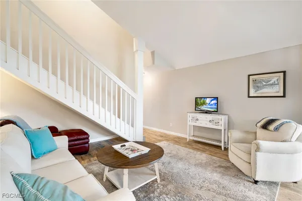 a living room with furniture and a table