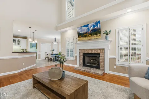 a kitchen with stainless steel appliances granite countertop a refrigerator a stove and a sink