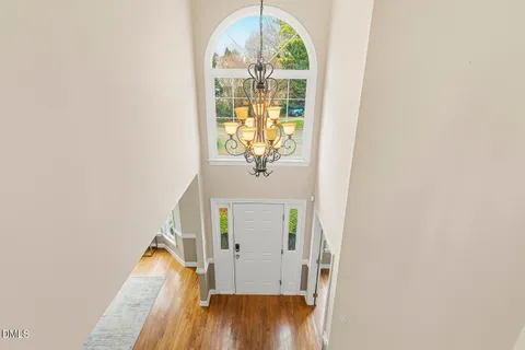 a view of empty room with wooden floor and cabinet