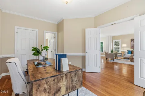 a living room with furniture a rug and a table