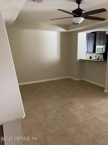 a view of a kitchen with a sink and cabinets