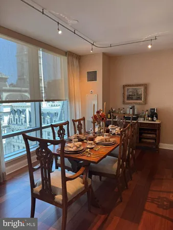 a view of a dining room with furniture and window