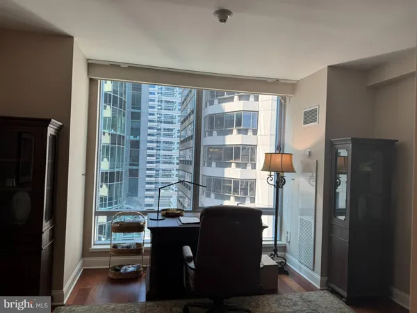 a view of a dining room with furniture and a window