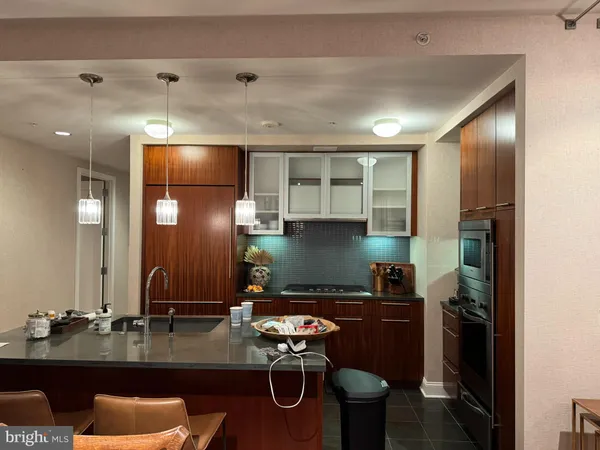 a kitchen with a refrigerator and a stove