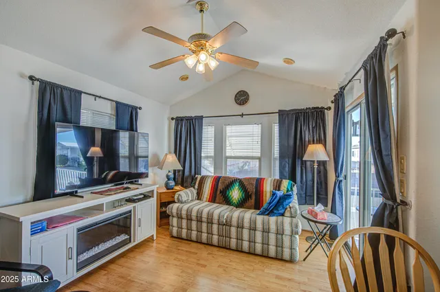 a bedroom with a bed window and flowerpot