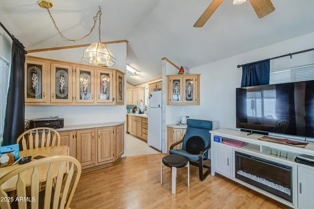 a bedroom with a bed and a view of kitchen