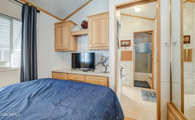 a bathroom with a toilet and a shower curtain