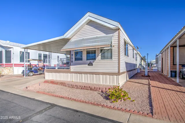 a view of a patio with table and chairs and potted plants