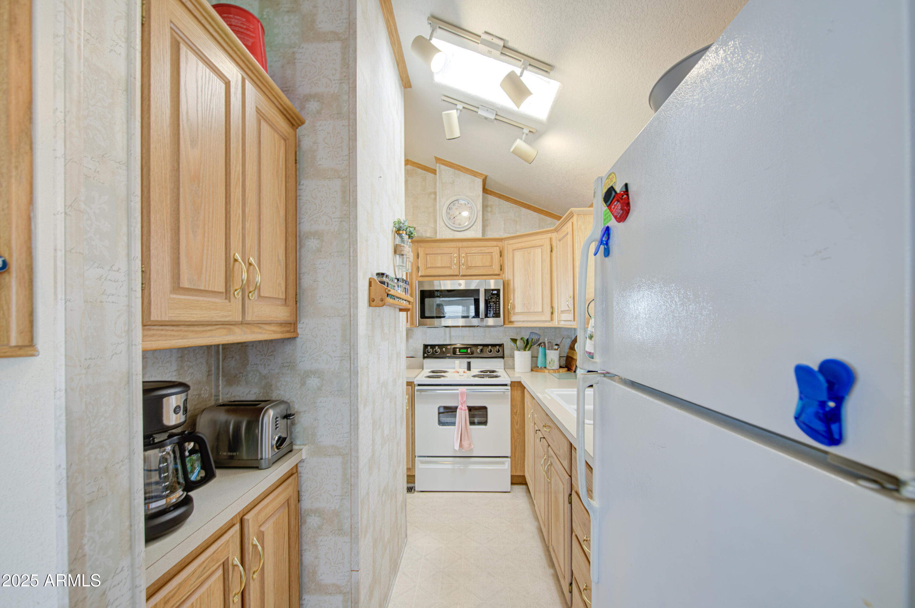 7750 East Broadway Road, Unit 250 Mesa, AZ 85208 - Photo 2 of 35 a kitchen with stainless steel appliances granite countertop a stove and a sink